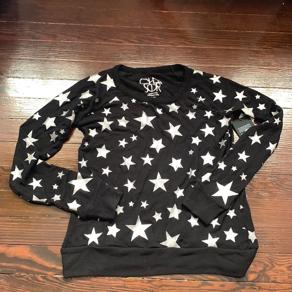 Soft black sweater with silver stars. New with tags. Size XS.